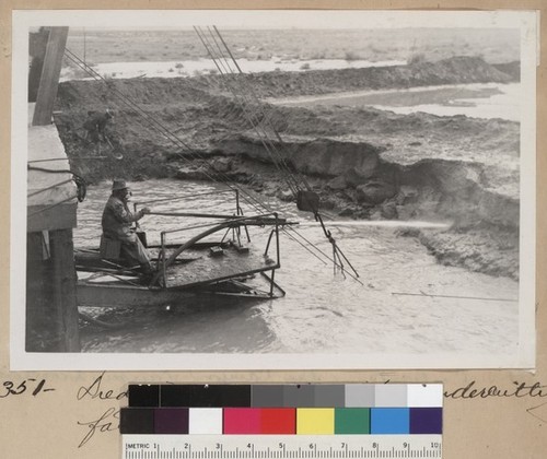 Dredge #1, water jet undercutting face of bank