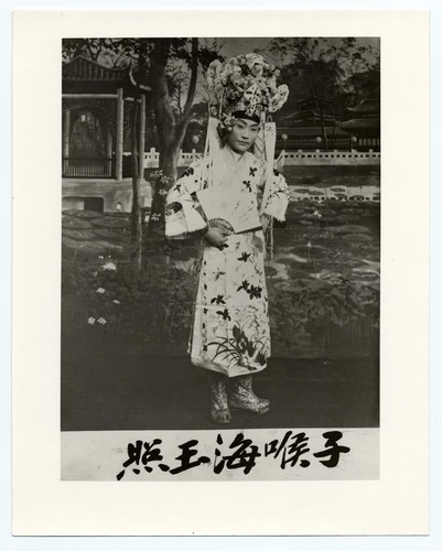 Tzu-hou-Hai in the role of a scholar holding a folding fan /
