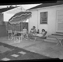 Three women sitting on a patio