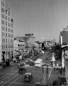 Looking east along Hollywood Boulevard from the intersection with Highland Avenue as the street becomes Santa Claus Lane for the Christmas season, ca.1938-1939
