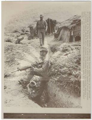 Laotian Soldier in Trench
