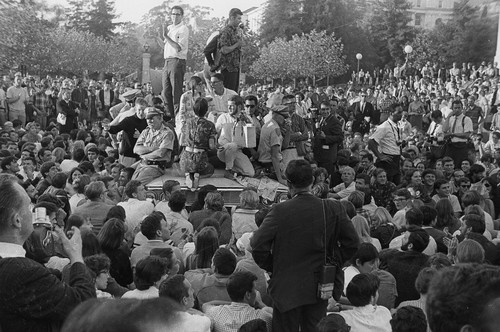 Art Goldberg and other students on top of police car