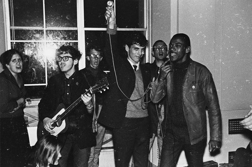 Students singing inside building probably Sproul Hall during Dec. 2nd sit-in