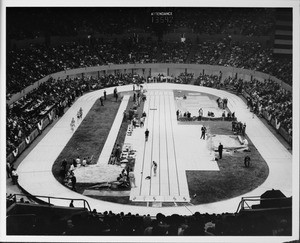 13,592 gather to watch a track and field event inside the Sports Arena in Downtown Los Angeles