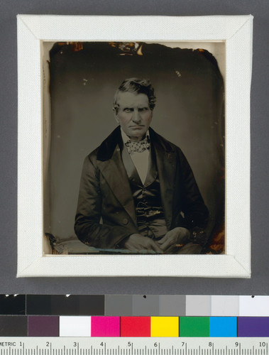 [Unidentified older man in a plaid bow tie.]