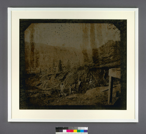 [Mining scene with a flume and miners, including a California Indian(?) in foreground.]