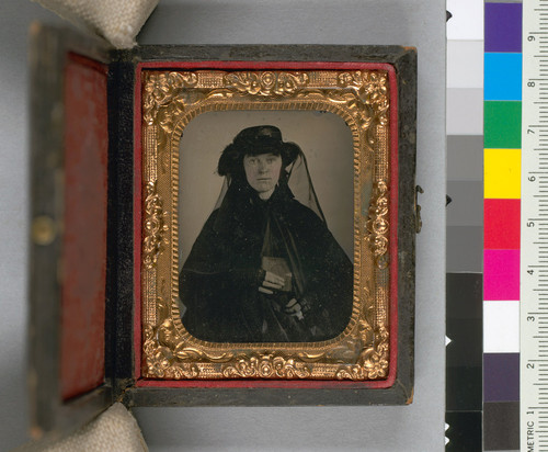 [Young gold rush widow, the mother of Mrs. Nellie Mayhood, of Oakland, holding a daguerreotype.]