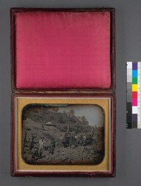 [Riverbed mining scene with fifteen miners, including Elmer Bliss.]