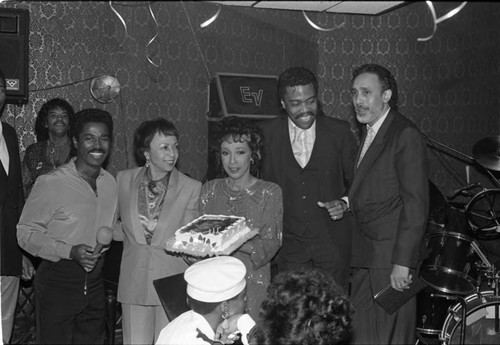 Reve Gipson holding her birthday cake at the Pied Piper nightclub, Los Angeles, 1987