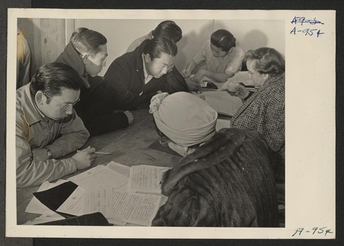 Residents of Japanese ancestry registering for indefinite leave in block 10. Photographer: Stewart, Francis Manzanar, California