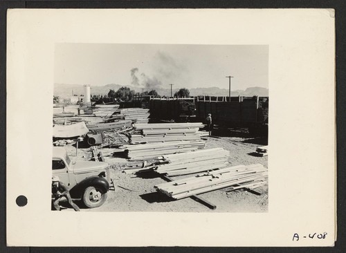 Poston, Arizona--Loading lumber for use in the construction of living quarters for evacuees of Japanese ancestry at the Colorado River War Relocation Authority Center. Photographer: Clark, Fred Poston, Arizona