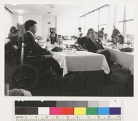 Kurt Lauridsen, Johnson Chu and unidentified people sitting at some sort of a reception