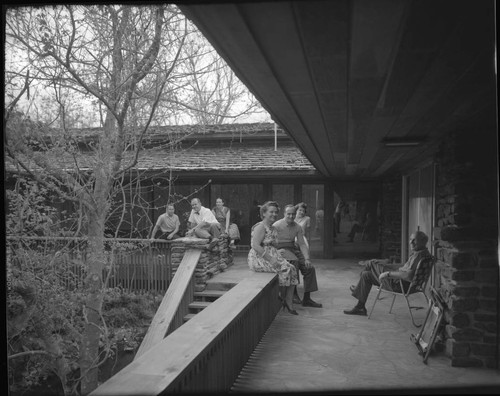 Walton, Sam, residence. E. Fay Jones is second from left wearing bow tie. and Outdoor living space