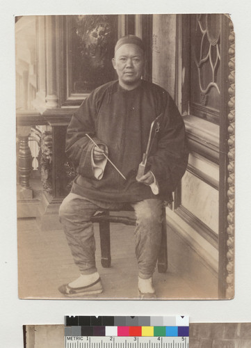 [Chinese man with musical instrument]