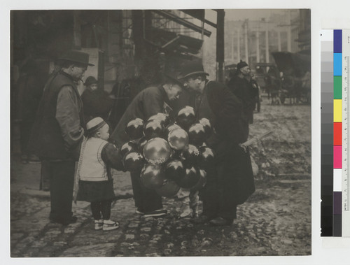 [Child and man, balloon vendors]