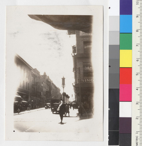 [View of street corner in Chinatown, San Francisco, Sing Fat Company to the right]