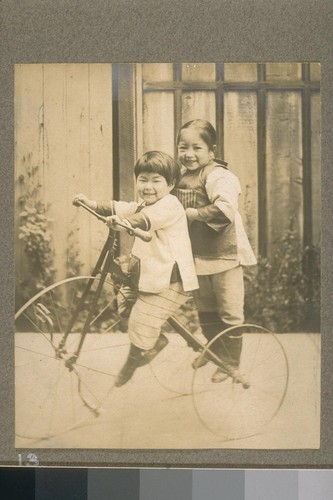 [Unidentified children on bicycle.]