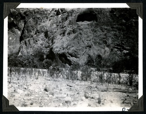 Bed of Santo Domingo River with Red Rock cave in the background