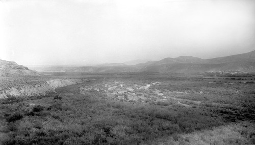 The El Rosario Valley, facing east, from near the big bend on north side with pueblo on the right side