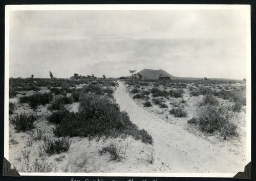 San Quintín as seen from the north, with the bay between the town and the volcanic cone