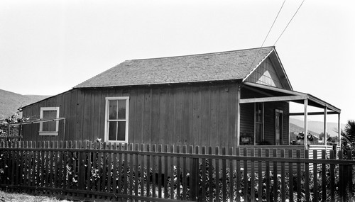 House #46-7 in Ensenada, small, good condition, board and batten, with clapboard front