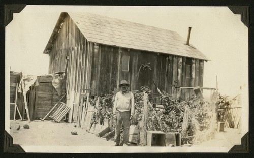 Anselmo Ortíz, sole inhabitant of Socorro Valley, in front of his house on the road from San Quintín to El Rosario