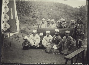 Buddhist priests in mourning, by a coffin (South China)