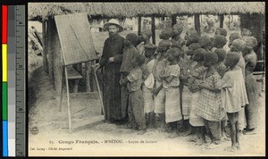 Missionary father teaching children outdoors, Congo, ca.1920-1940