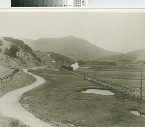 Northwestern Pacific Railroad train steaming through Mill Valley