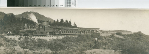 Motor No. 1 "Black Maria" on a Muir Woods shuttle or work train assignment and Engine No. 5 with train on the Mount Tamalpais and Muir Woods Railway at Mesa Station taking on water before resuming its uphill push at the Double Bow-Knot, half way up Mount Tamalpais