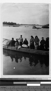 Maryknoll Sisters crossing the river by ferry, Yeung Kong, China, ca. 1920