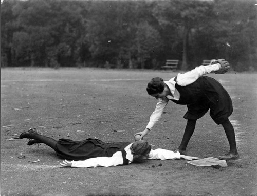 Photograph of two women playing baseball