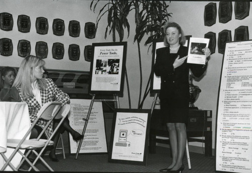 Woman presenting Apple Computer Marketing project