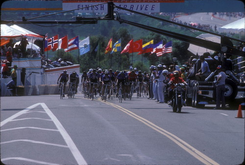 [1984 Olympics Women's Cycling Road Race with cyclists racing over finish line slide]