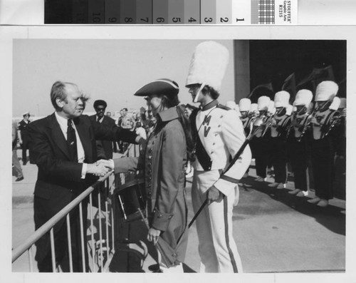 [President Gerald Ford shaking hands with a Mission Viejo High School Marching Band member photograph]