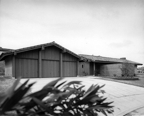 [Mission Ridge model home exterior with board and batten siding photograph]