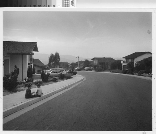 [Mission Viejo neighborhood with two boys on sidewalk photograph]