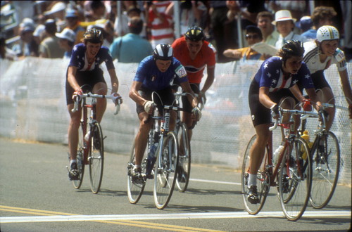 [1984 Olympics Women's Cycling Road Race showing Connie Carpenter, Rebecca Twigg, and three international competitors racing in a pack slide]