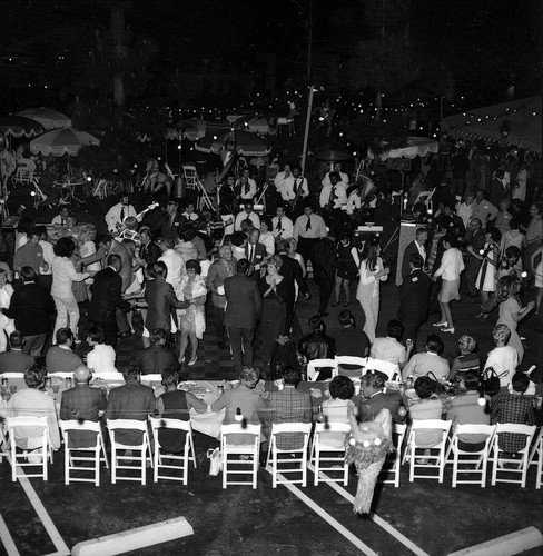 [Seville Homes grand opening evening party, circa 1970 photograph]