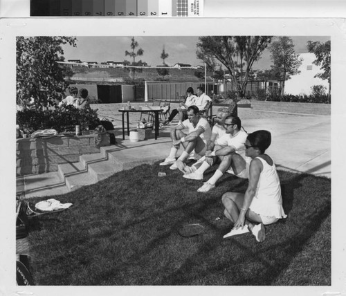 [Adults in tennis attire sitting at Montanoso Recreation Center, circa 1968 photograph]