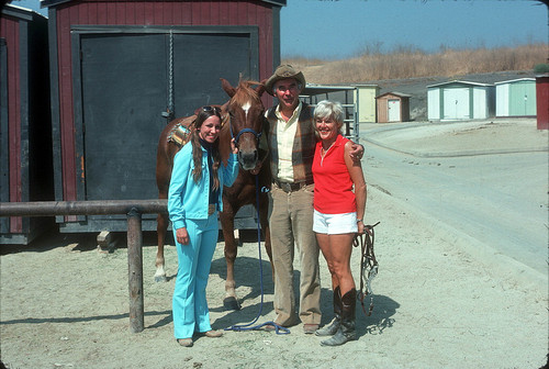 [Philip J. Reilly, two women and a horse at Mission Viejo Equestrian Center, 1975 slide]