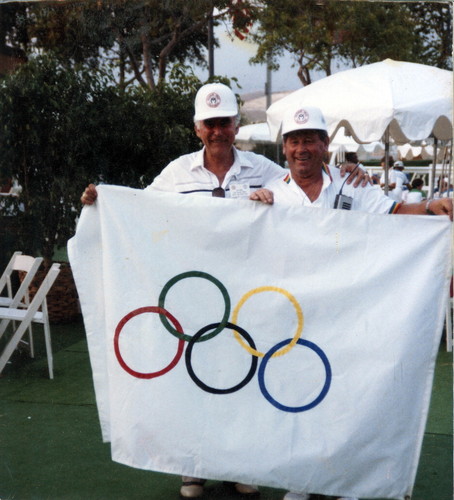 [Philip J. Reilly and Ziggy Wilczynski holding Olympic flag photograph]