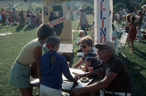 [State of Illinois welcome table at Fourth of July celebration, 1976 slide]