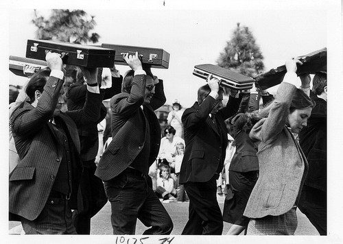 [Bankers and briefcases at St. Patrick's Day parade, 1981 photograph]