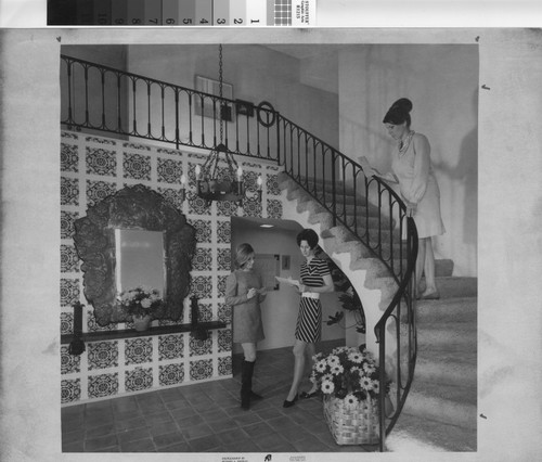 [Women inside the Spanish-style foyer of a home, 1969 photograph]