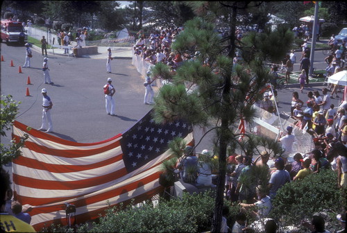 [1984 Olympics Cycling Road Race showing large American flag and spectators slide]