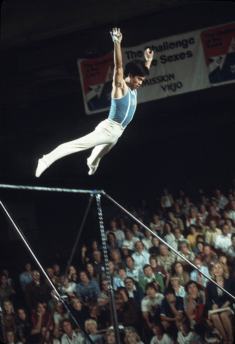 [Makoto Sakamoto competing on the high bar at "Challenge of the Sexes," 1975 slide]