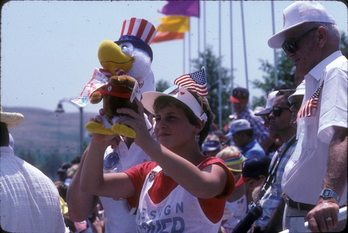 [1984 Olympics Cycling Road Race showing "Sam the Olympic Eagle" mascot slide]