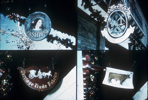 [Signs of retail businesses at La Paz Plaza, circa 1969 slide]