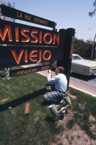 [Changing the population count on the Mission Viejo La Paz Entrance sign slide]